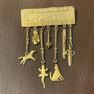 Vintage Jonette Jewelry (JJ) 1988 gold tone southwest style dangle charm brooch